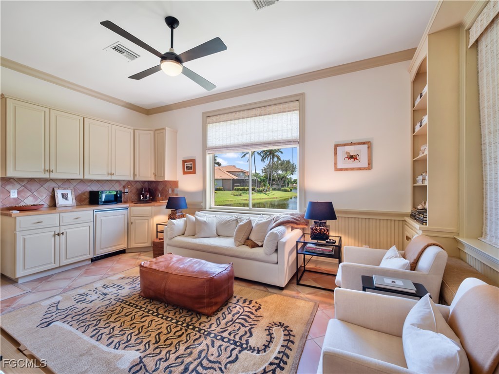 11511 Compass Point Drive Fort Myers, FL 33908 - Photo 38 of 46 a living room with furniture and a large window