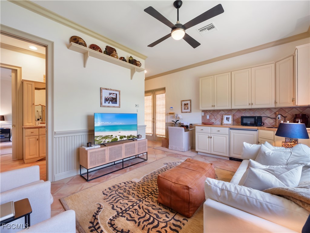 11511 Compass Point Drive Fort Myers, FL 33908 - Photo 39 of 46 a living room with furniture and kitchen view