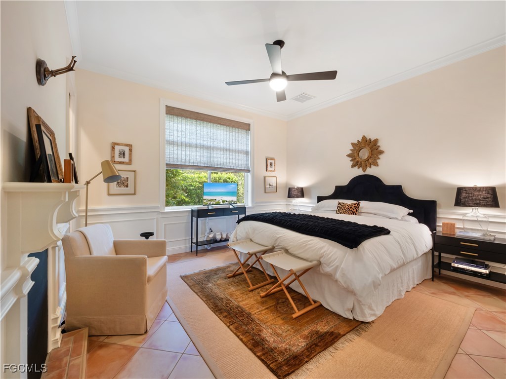 11511 Compass Point Drive Fort Myers, FL 33908 - Photo 41 of 46 a bedroom with a bed a couch and a window