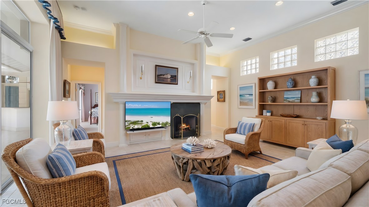 11511 Compass Point Drive Fort Myers, FL 33908 - Photo 5 of 46 a living room with furniture and a fireplace