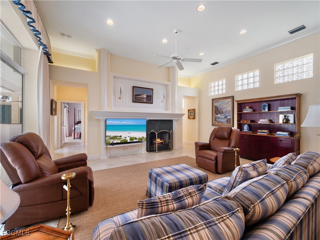 11511 Compass Point Drive Fort Myers, FL 33908 - Photo 6 of 46 a living room with furniture and a fireplace