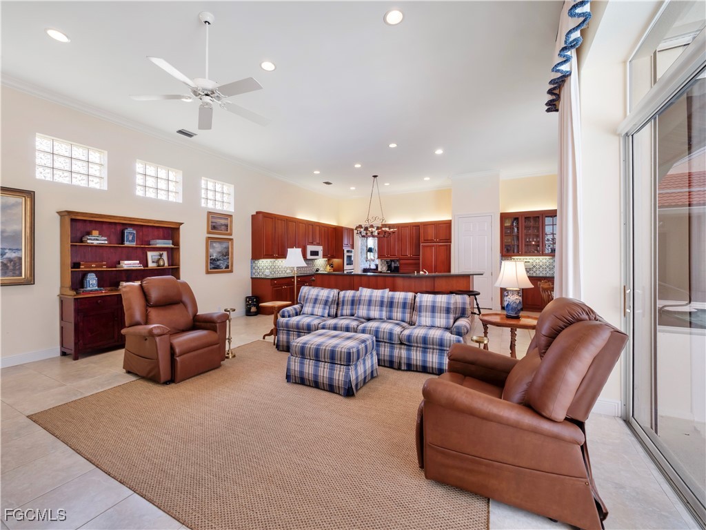 11511 Compass Point Drive Fort Myers, FL 33908 - Photo 9 of 46 a living room with furniture kitchen view and a chandelier