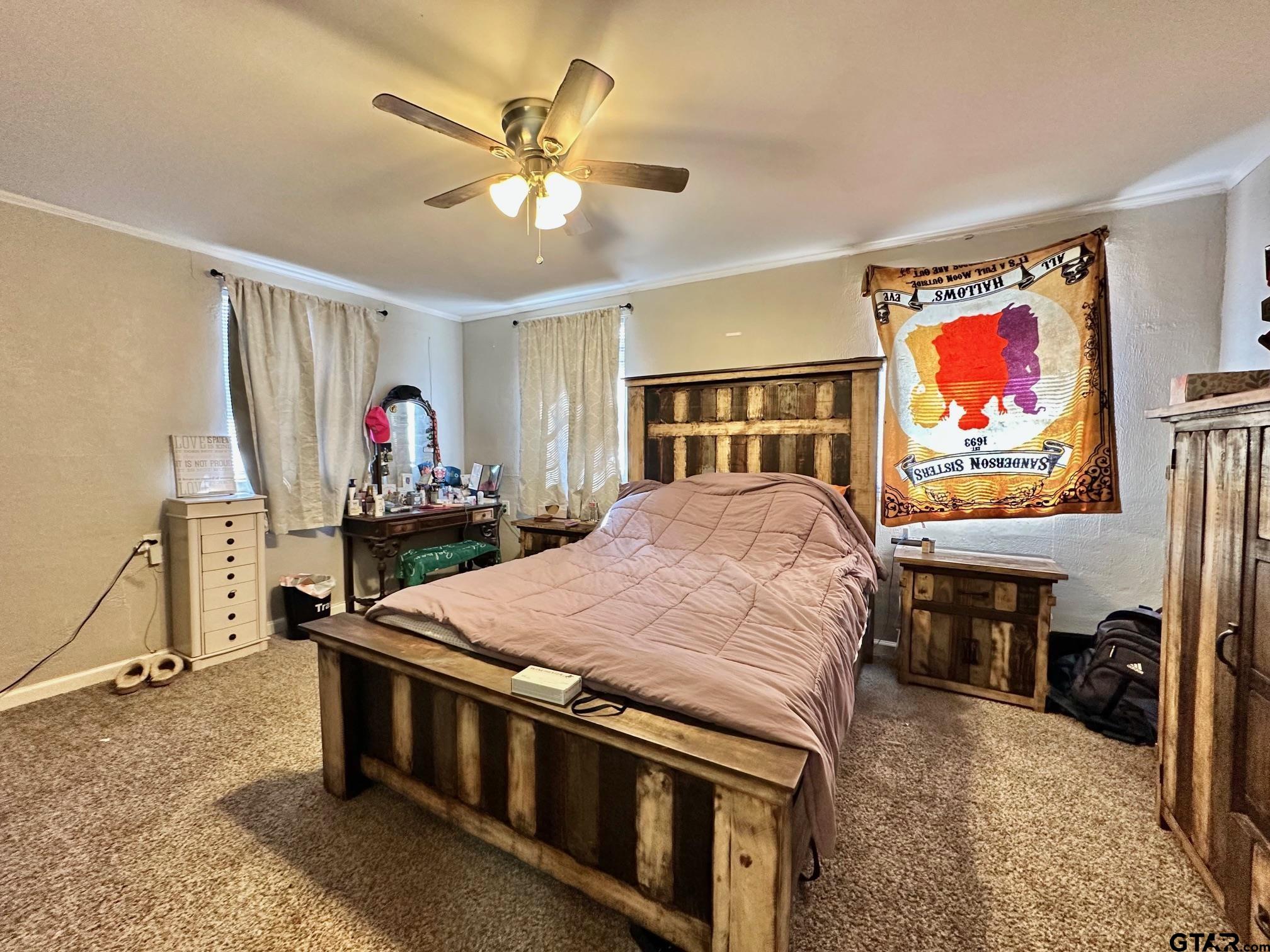 2601 East George Richey Road Longview, TX 75604 - Photo 21 of 26 a bed room with furniture and paintings on the wall