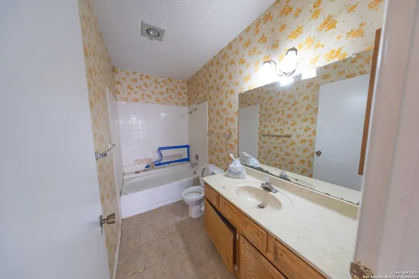 a view of an empty room and a window