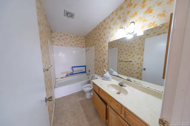 a view of an empty room and a window