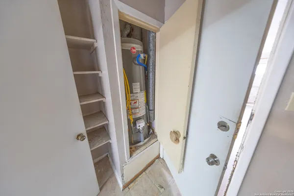 a bedroom with a bed and a stove