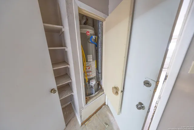 a bedroom with a bed and a stove
