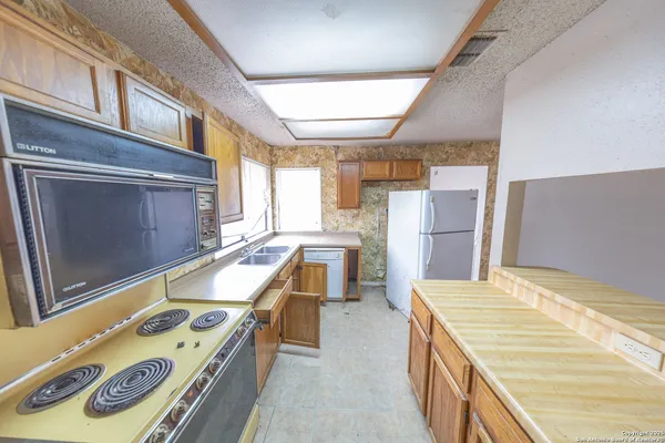 a view of kitchen and utility room