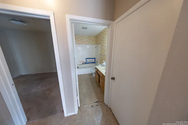 a bathroom with a sink a mirror and a bathtub