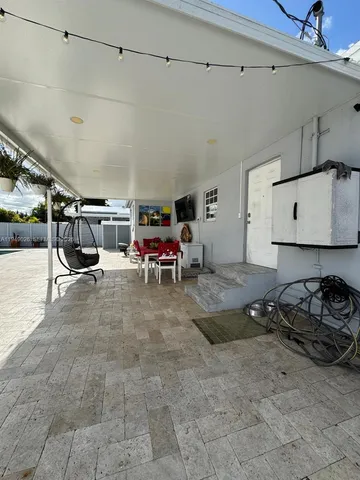 a view of balcony with furniture