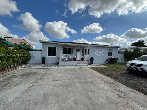 a view of house with yard and entertaining space
