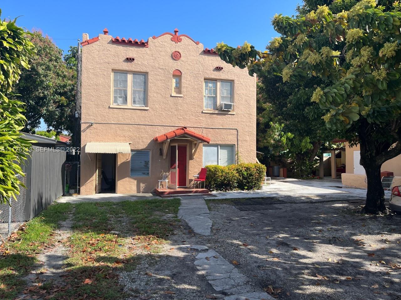 1703 Southwest 10th Street Miami, FL 33135 - Photo 1 of 1 a view of a white house with a yard