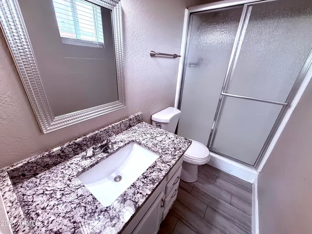 a view of washer and dryer with wooden floor