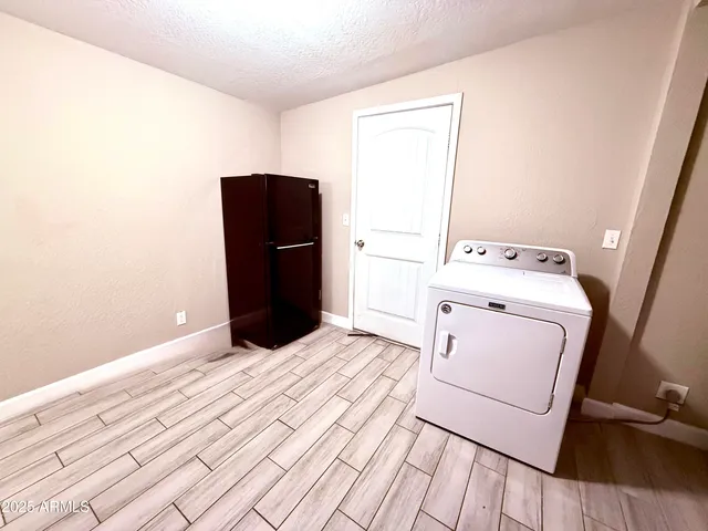 a view of a backyard with sitting area