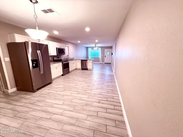 a view of a kitchen with a sink