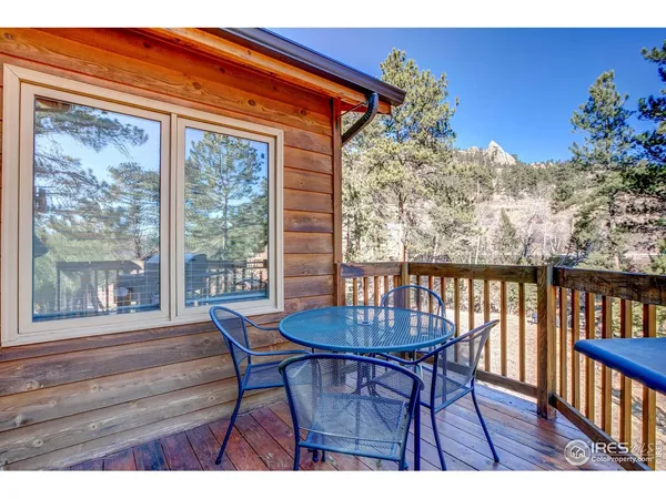 a outdoor dining space with furniture and garden view