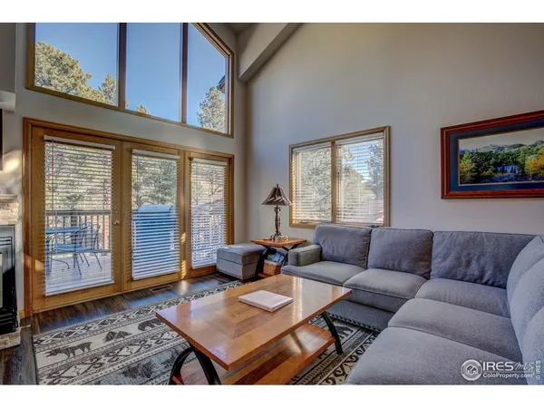 a living room with furniture and large window