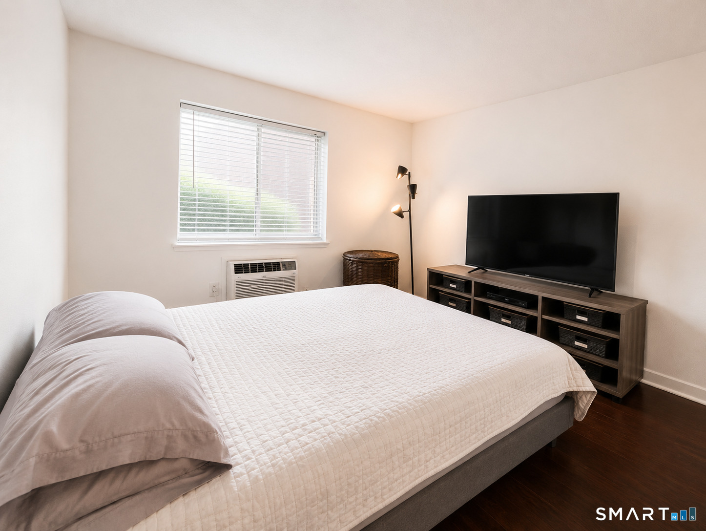 914 High Path Road, Unit 914 Windsor, CT 06095 - Photo 16 of 23 a bedroom with a bed and a flat screen tv