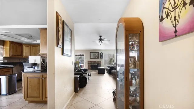 a view of a living room with furniture and a view of kitchen