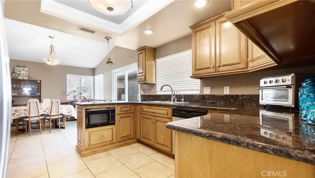 a kitchen with stainless steel appliances granite countertop a stove and a sink