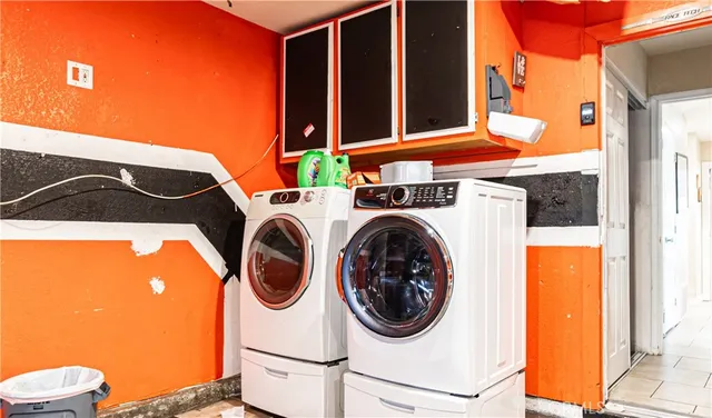 a view of backyard with swimming pool and furniture