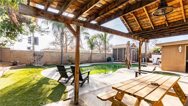 a swimming pool with outdoor seating yard and patio