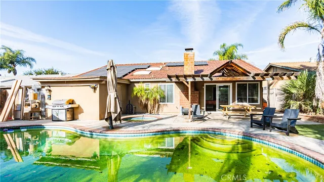 a view of a swimming pool with a patio