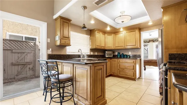 a kitchen with stainless steel appliances granite countertop a stove and a refrigerator