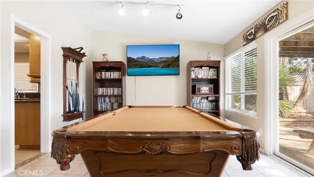 a bedroom with a bed and a bookshelf