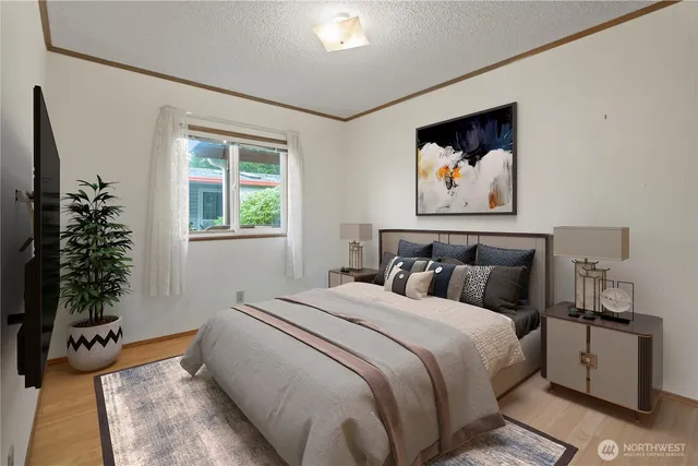 a bedroom with bed and a window