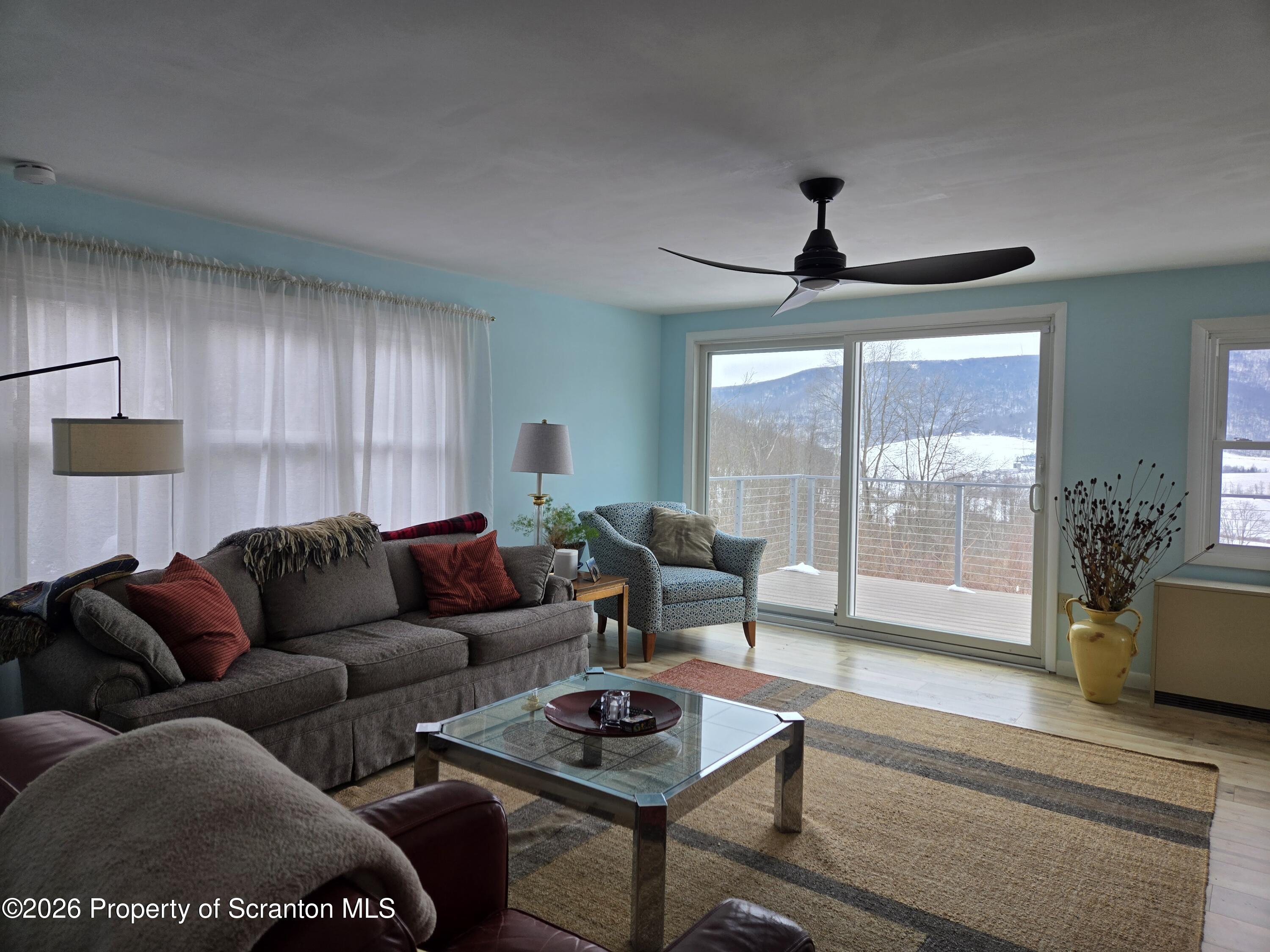 915 Sugar Hollow Road Tunkhannock, PA 18657 - Photo 13 of 48 a living room with furniture and a window