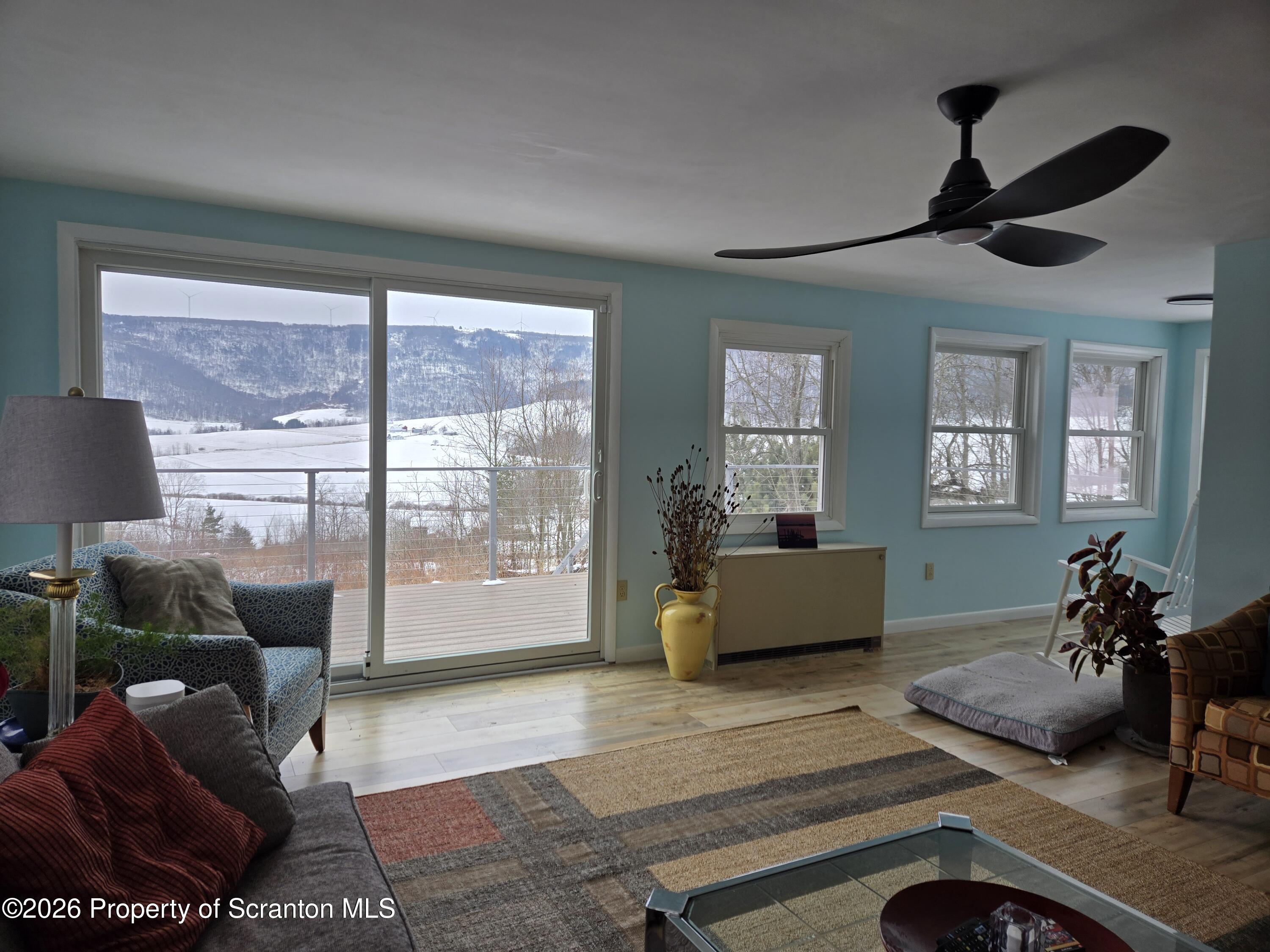 915 Sugar Hollow Road Tunkhannock, PA 18657 - Photo 14 of 48 a living room with furniture and a large window