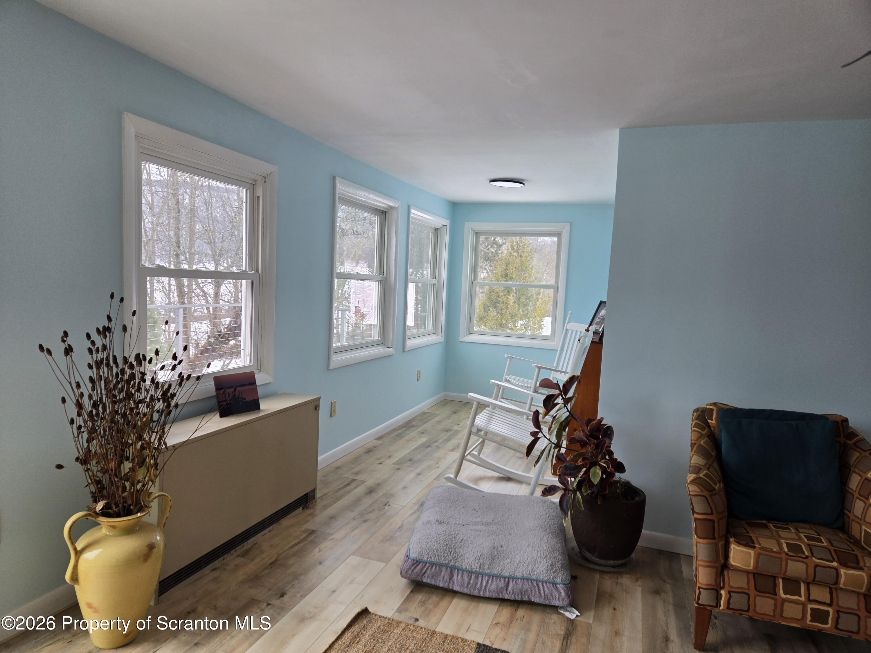 915 Sugar Hollow Road Tunkhannock, PA 18657 - Photo 16 of 48 a living room with furniture and a window