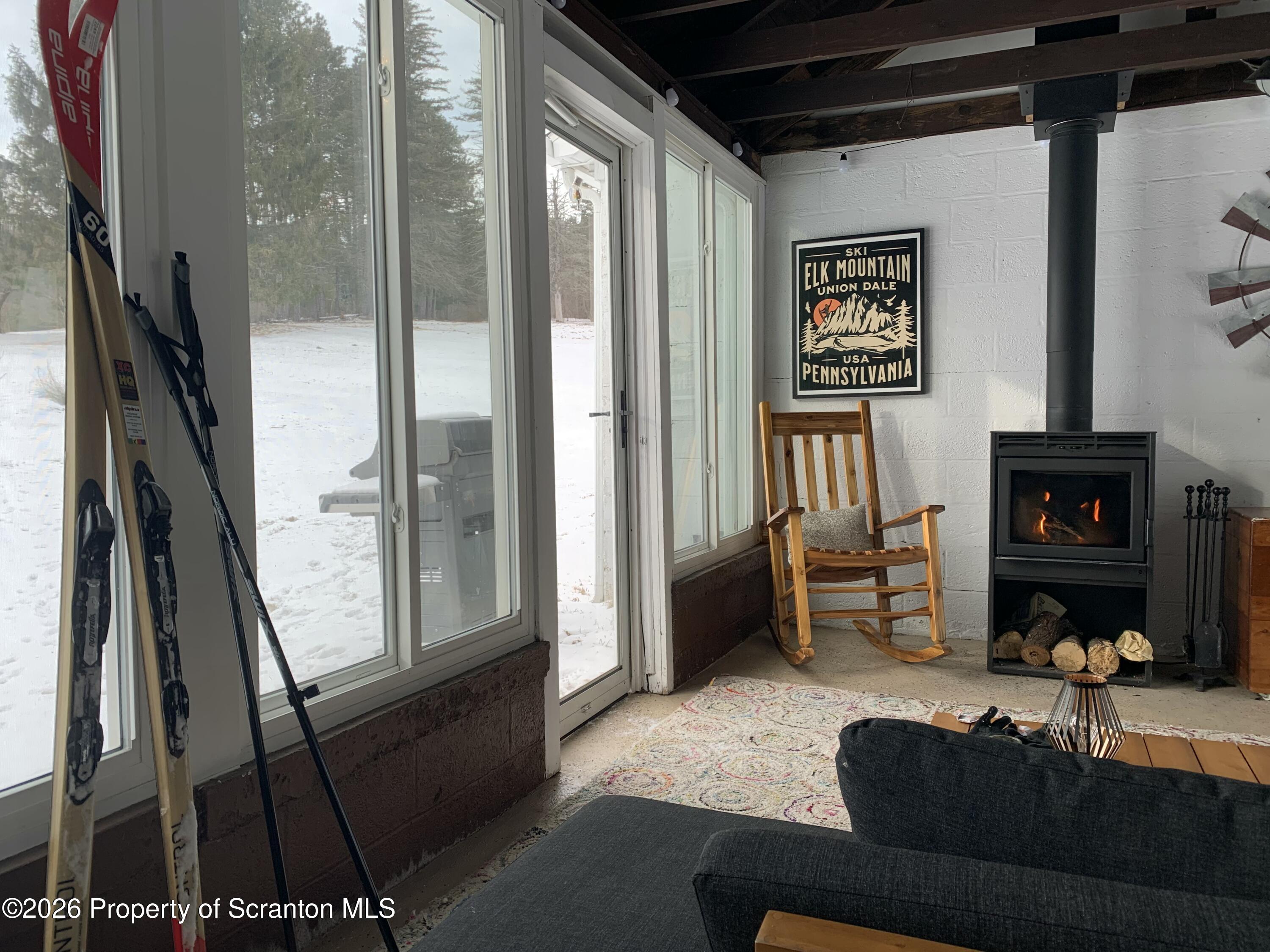 915 Sugar Hollow Road Tunkhannock, PA 18657 - Photo 19 of 48 a living room with furniture and a fireplace