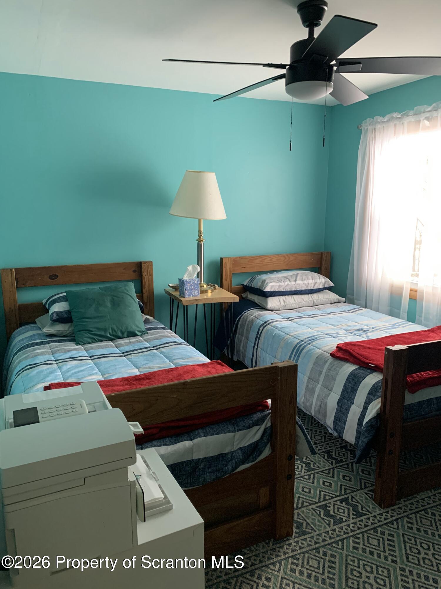 915 Sugar Hollow Road Tunkhannock, PA 18657 - Photo 23 of 48 a bedroom with two beds and a chair