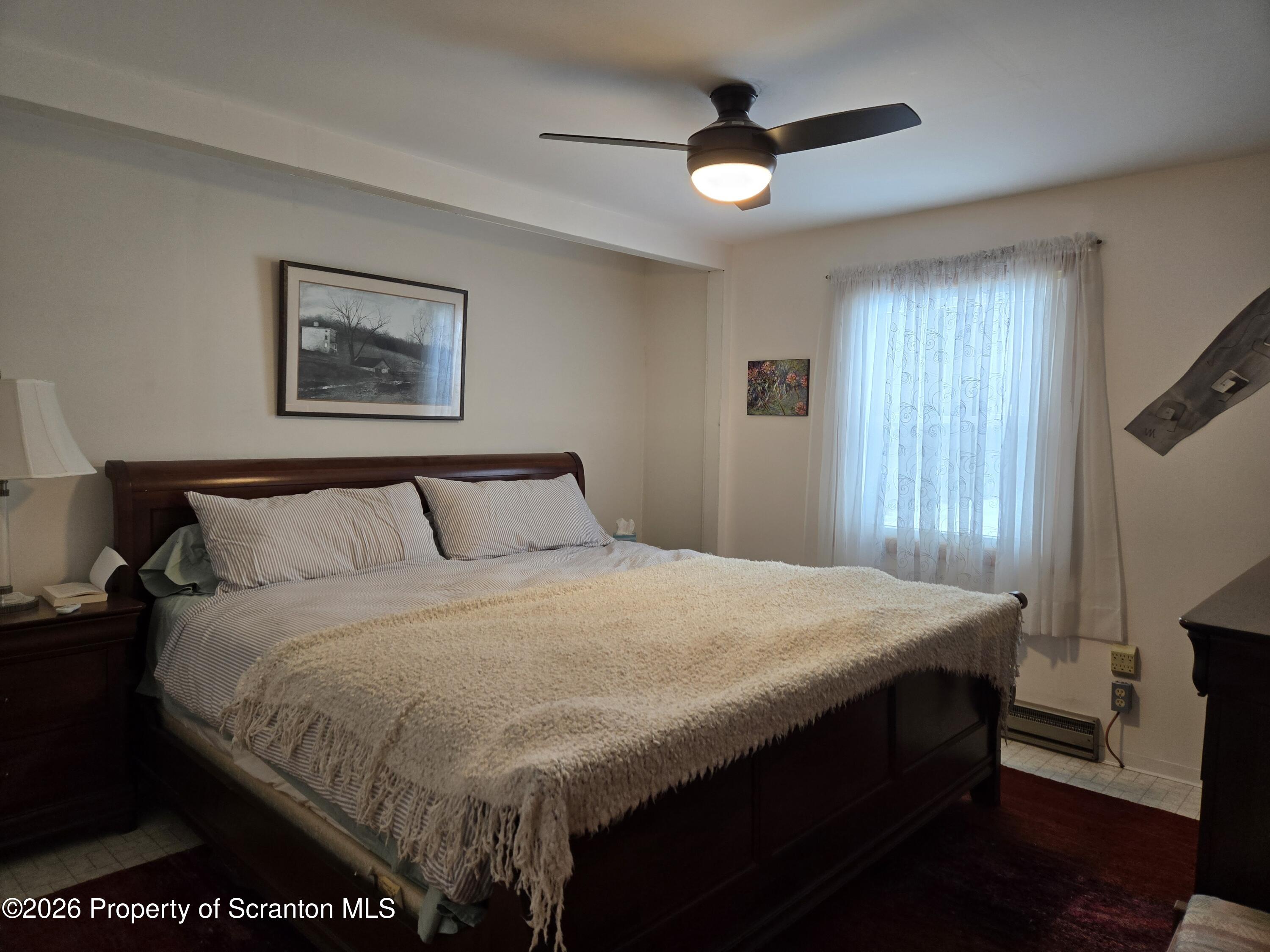 915 Sugar Hollow Road Tunkhannock, PA 18657 - Photo 24 of 48 a bedroom with a bed and a large mirror