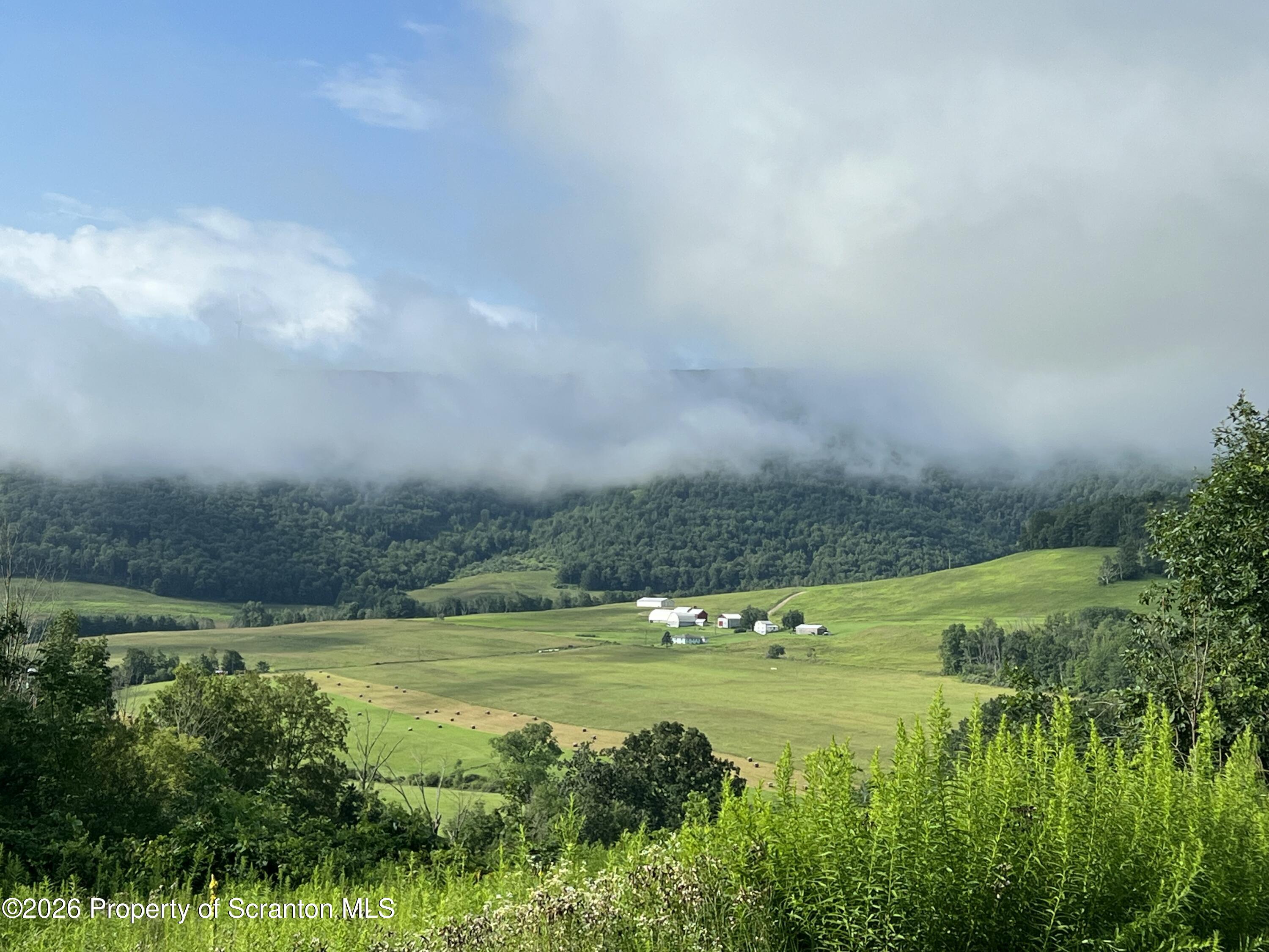 915 Sugar Hollow Road Tunkhannock, PA 18657 - Photo 8 of 48 a view of a field with an ocean