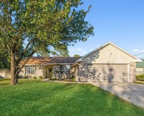 a view of house with yard