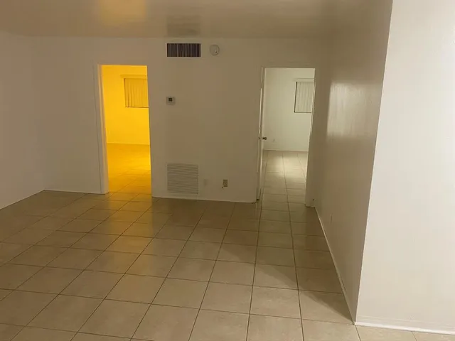 an empty room with a bathroom