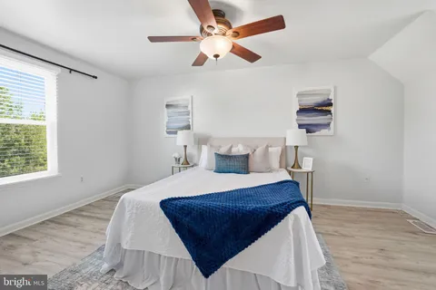 a bed room with a bed and a window