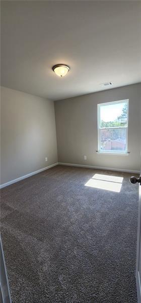 1476 Fern Ridge Lane Norcross, GA 30093 - Photo 8 of 19 an empty room with a empty space and windows