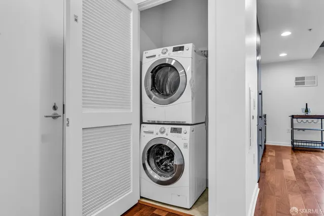 a view of a hallway with washer and dryer