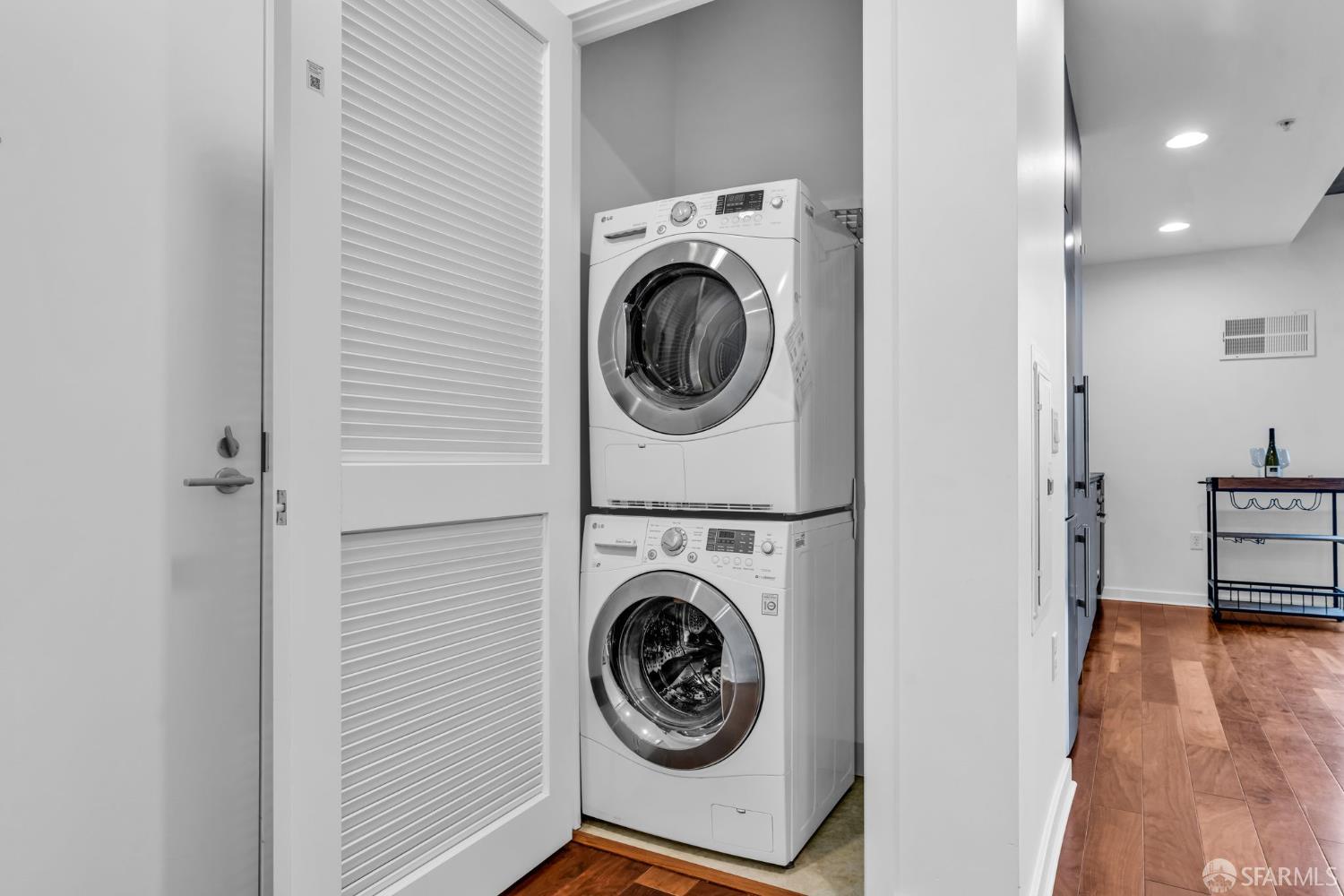 45 Bartlett Street, Unit 416 San Francisco, CA 94110 - Photo 16 of 36 a view of a hallway with washer and dryer