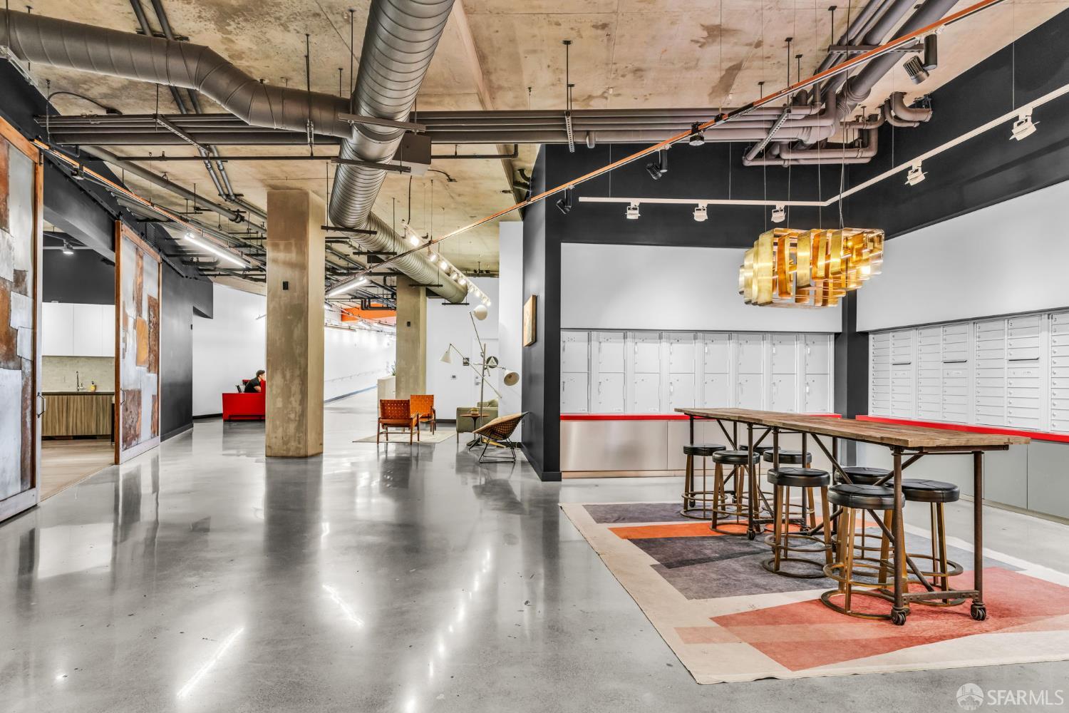 45 Bartlett Street, Unit 416 San Francisco, CA 94110 - Photo 24 of 36 a view of a swimming pool with a patio and dining table