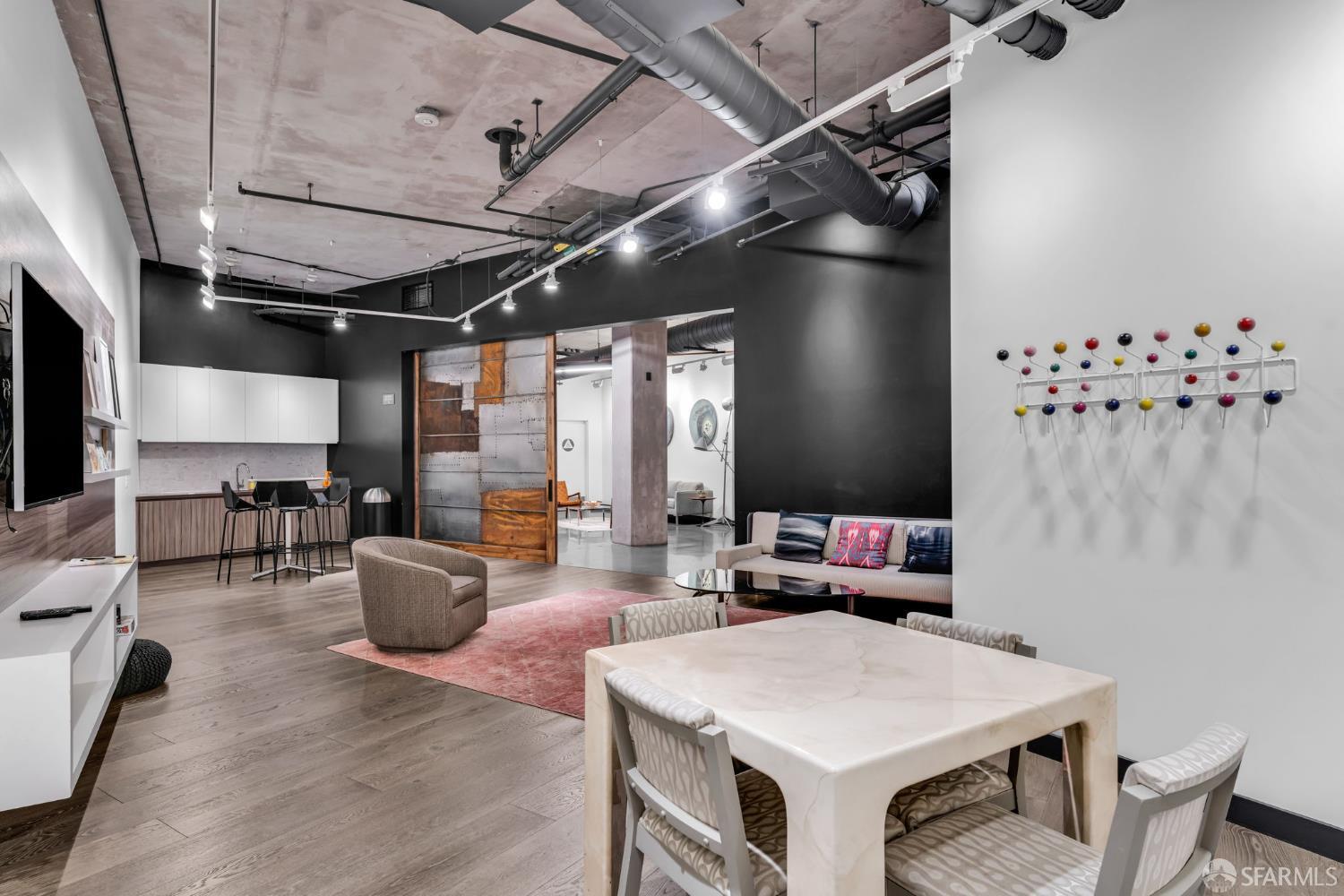 45 Bartlett Street, Unit 416 San Francisco, CA 94110 - Photo 25 of 36 a living room with furniture a chandelier and a window