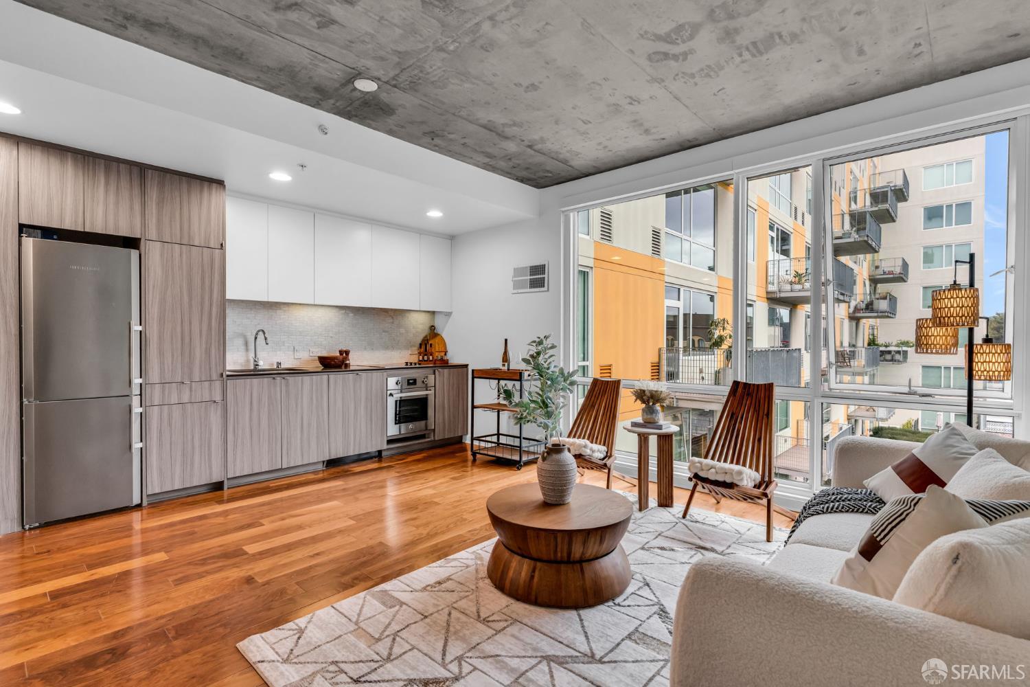 45 Bartlett Street, Unit 416 San Francisco, CA 94110 - Photo 6 of 36 a living room with furniture and a large window