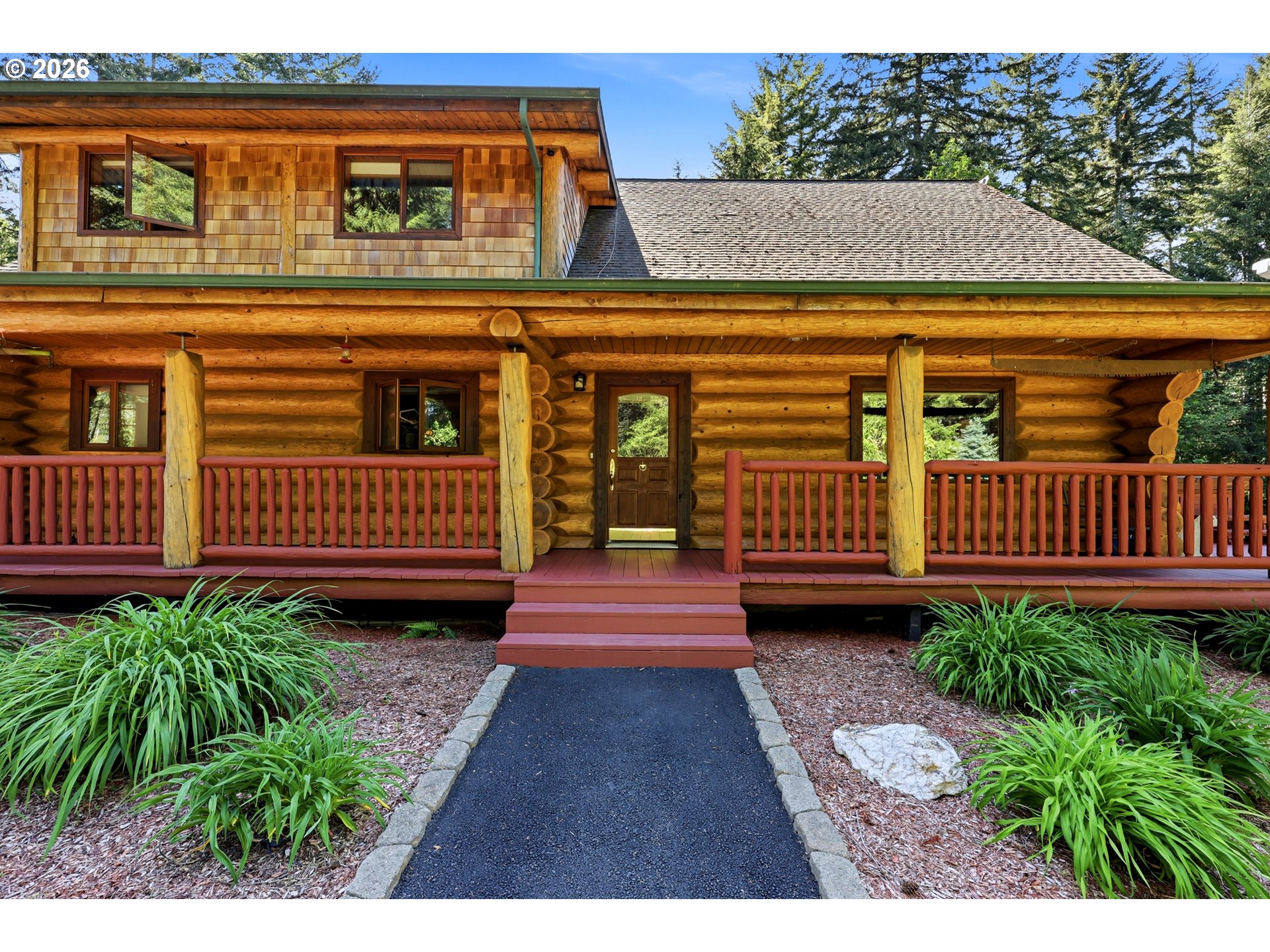 390 Spruce Creek Road Longview, WA 98632 - Photo 11 of 45 a view of a house with a wooden fence