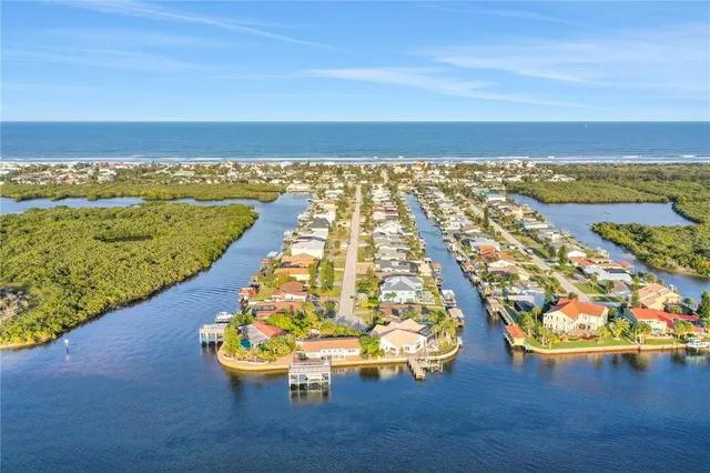 a view of a livingroom with furniture and chandelier fan