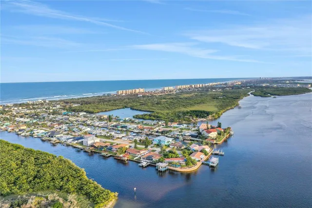a kitchen with granite countertop a sink stainless steel appliances and cabinets