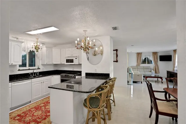 a bedroom with a bed and cabinets